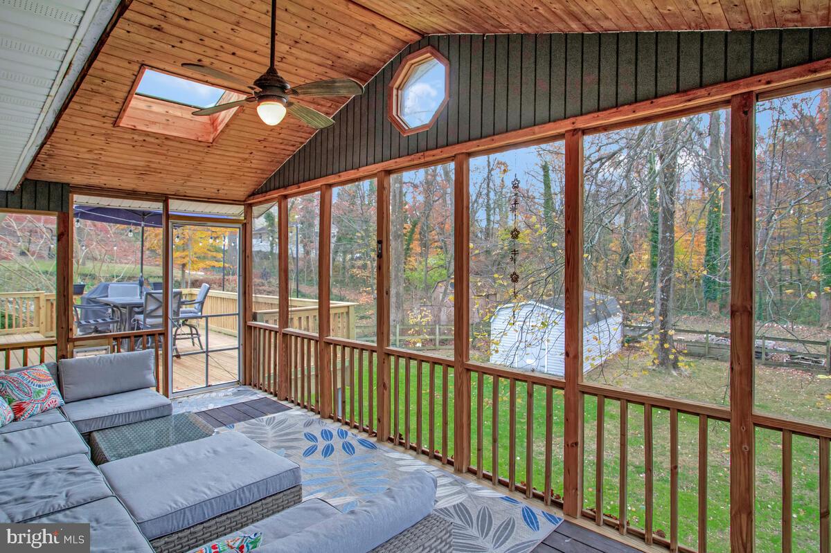 437 Kingwood Road Linthicum Heights, MD 21090 - Photo 13 of 38 a view of a porch with wooden floor and furniture