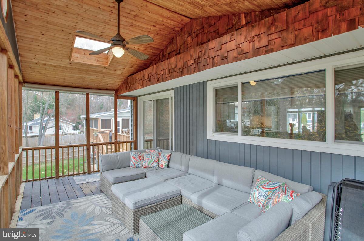 437 Kingwood Road Linthicum Heights, MD 21090 - Photo 14 of 38 a living room with furniture and a flat screen tv