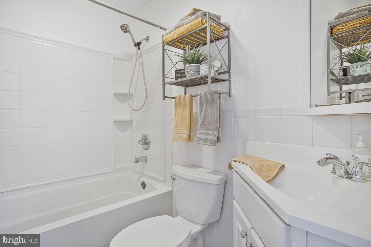 437 Kingwood Road Linthicum Heights, MD 21090 - Photo 22 of 38 a bathroom with a sink a toilet and a bathtub
