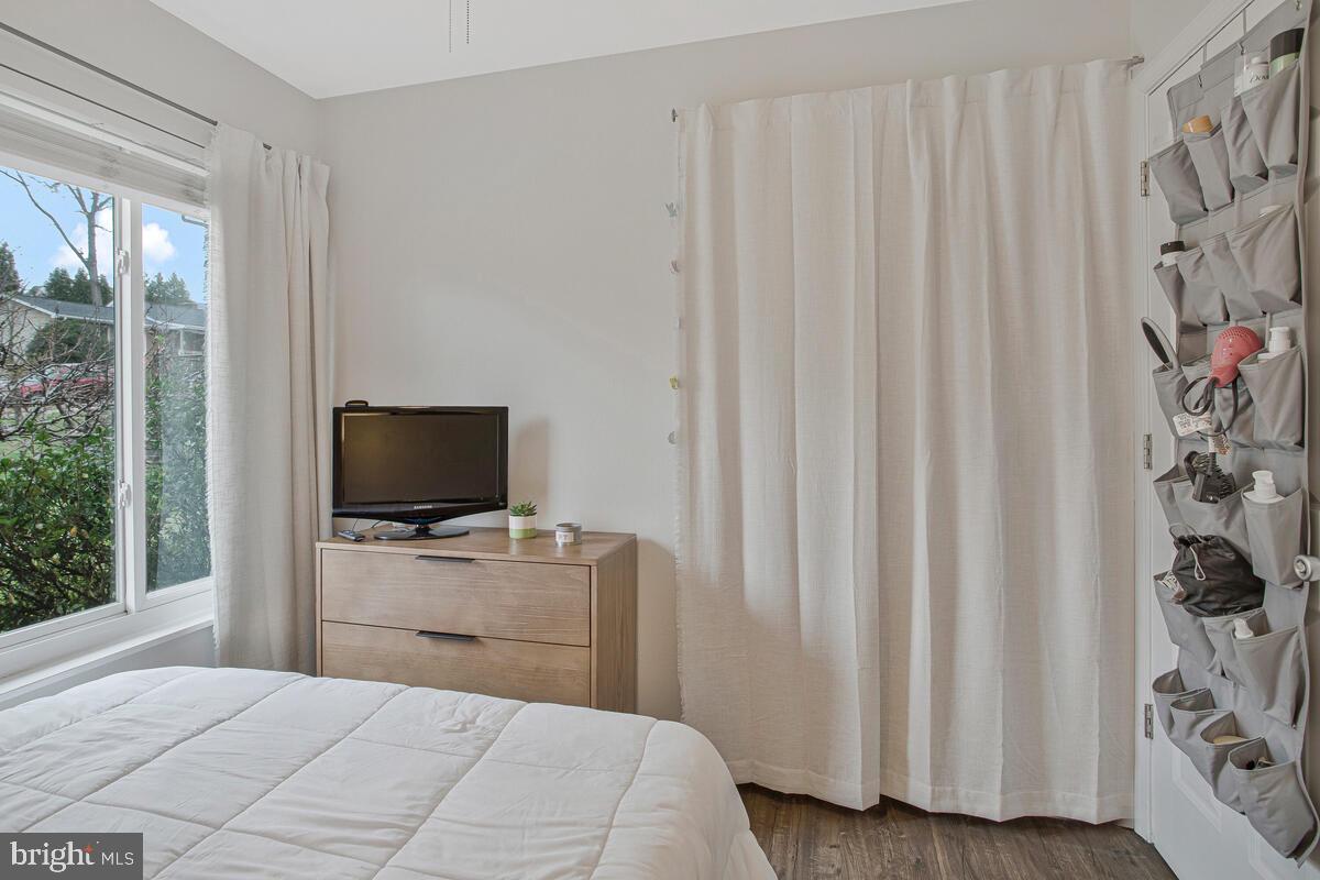 437 Kingwood Road Linthicum Heights, MD 21090 - Photo 24 of 38 a bedroom with a bed and a flat tv screen on the dresser