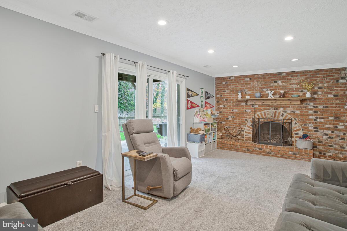 437 Kingwood Road Linthicum Heights, MD 21090 - Photo 26 of 38 a living room with furniture and a fireplace