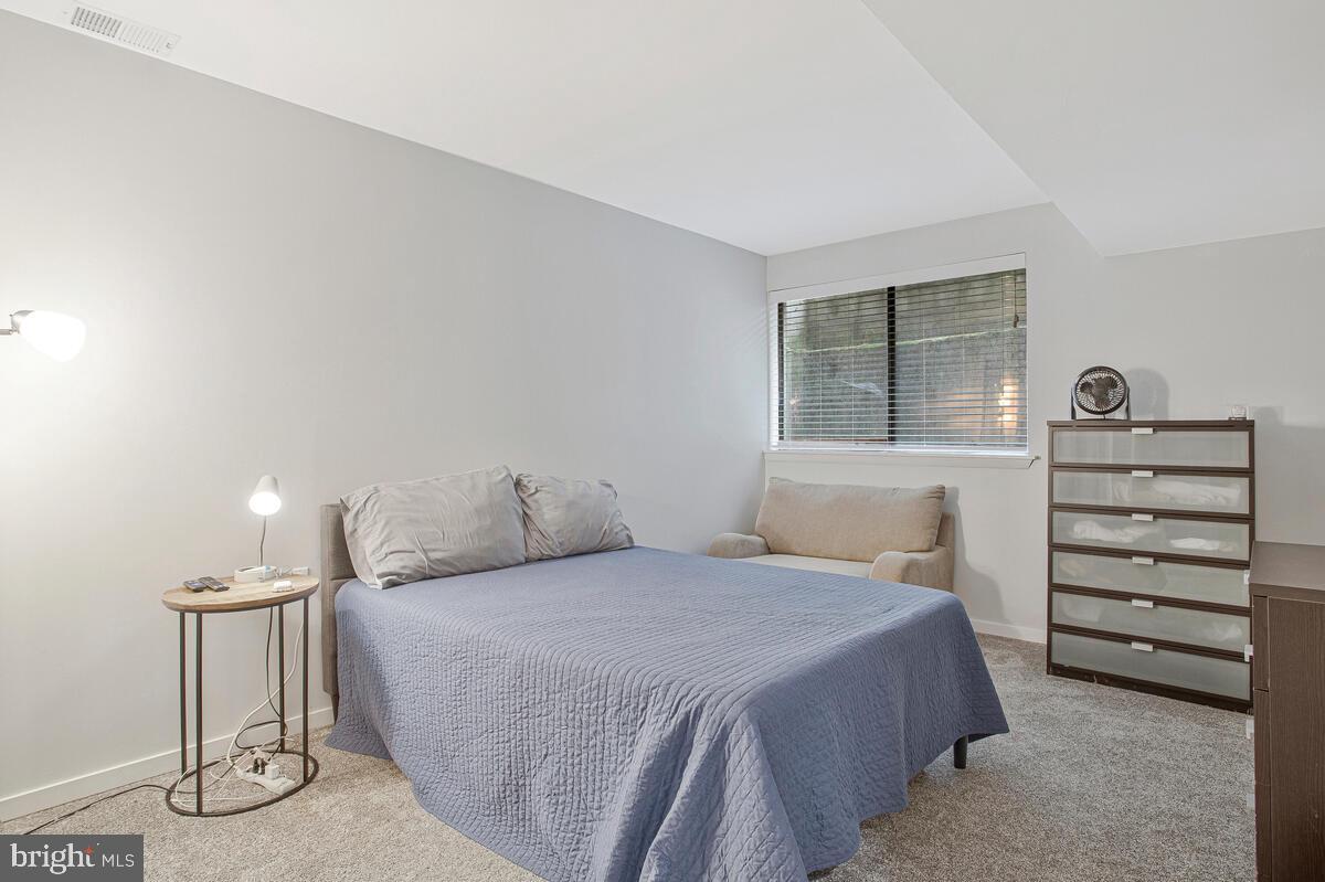 437 Kingwood Road Linthicum Heights, MD 21090 - Photo 28 of 38 a bedroom with a bed and a window