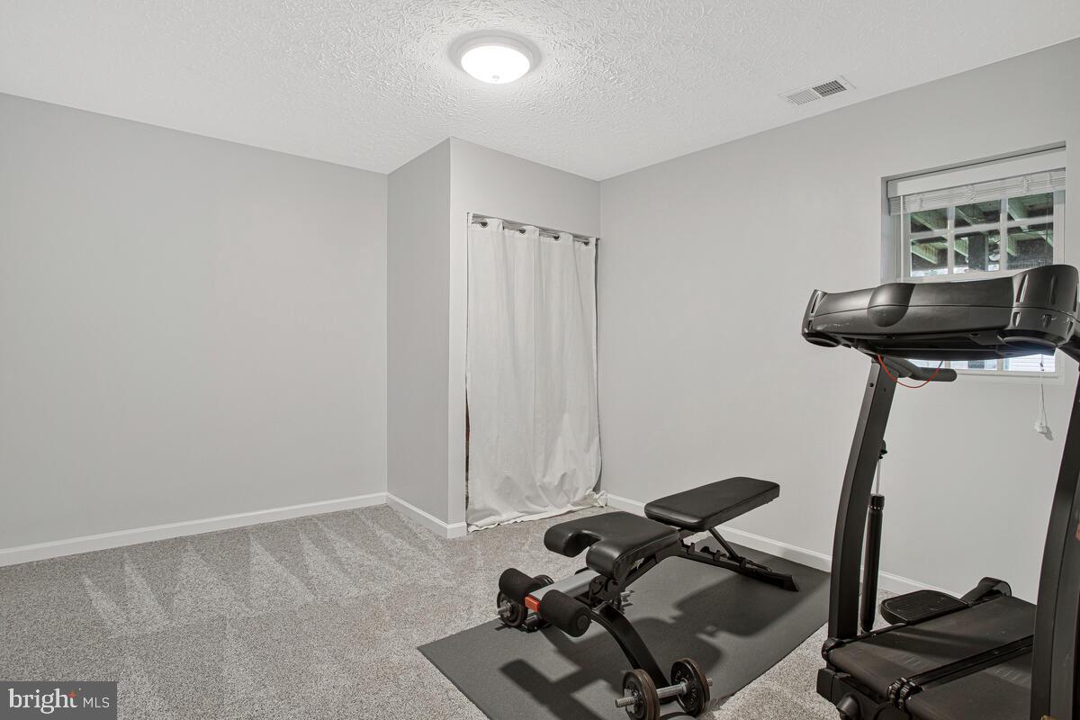 437 Kingwood Road Linthicum Heights, MD 21090 - Photo 30 of 38 a view of a room with gym equipment