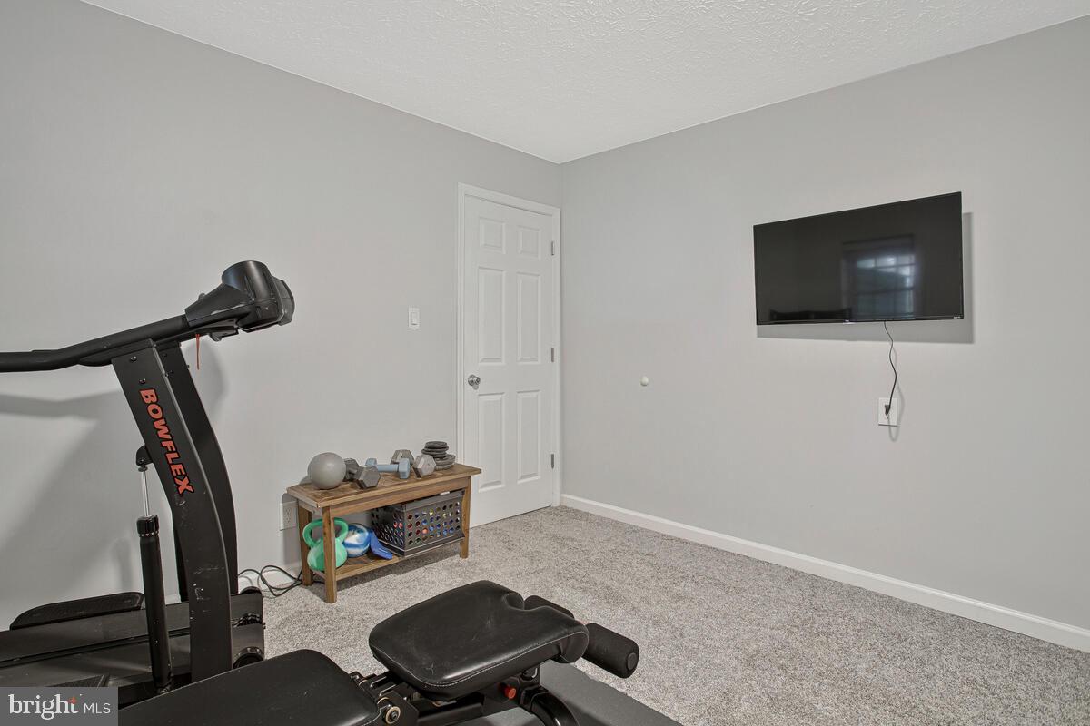 437 Kingwood Road Linthicum Heights, MD 21090 - Photo 31 of 38 a room with furniture and a flat screen tv