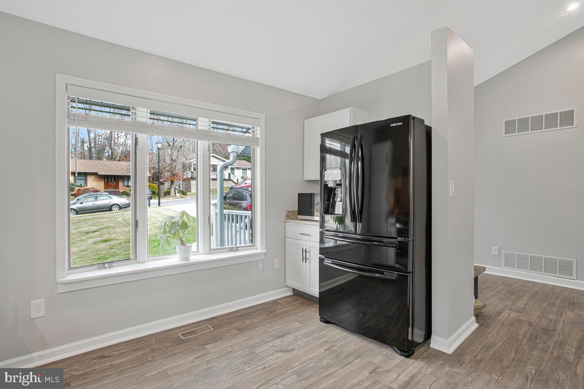 437 Kingwood Road Linthicum Heights, MD 21090 - Photo 10 of 38 a kitchen with a refrigerator and a window