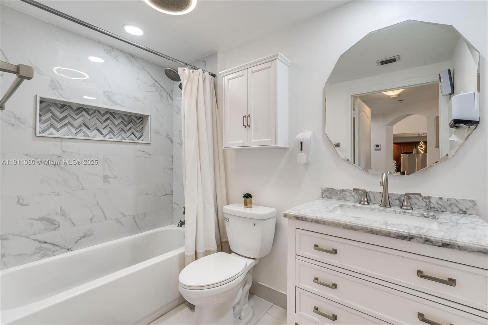 100 North Federal Highway, Unit 1413 Fort Lauderdale, FL 33301 - Photo 11 of 33 a bathroom with a granite countertop sink toilet mirror and bathtub
