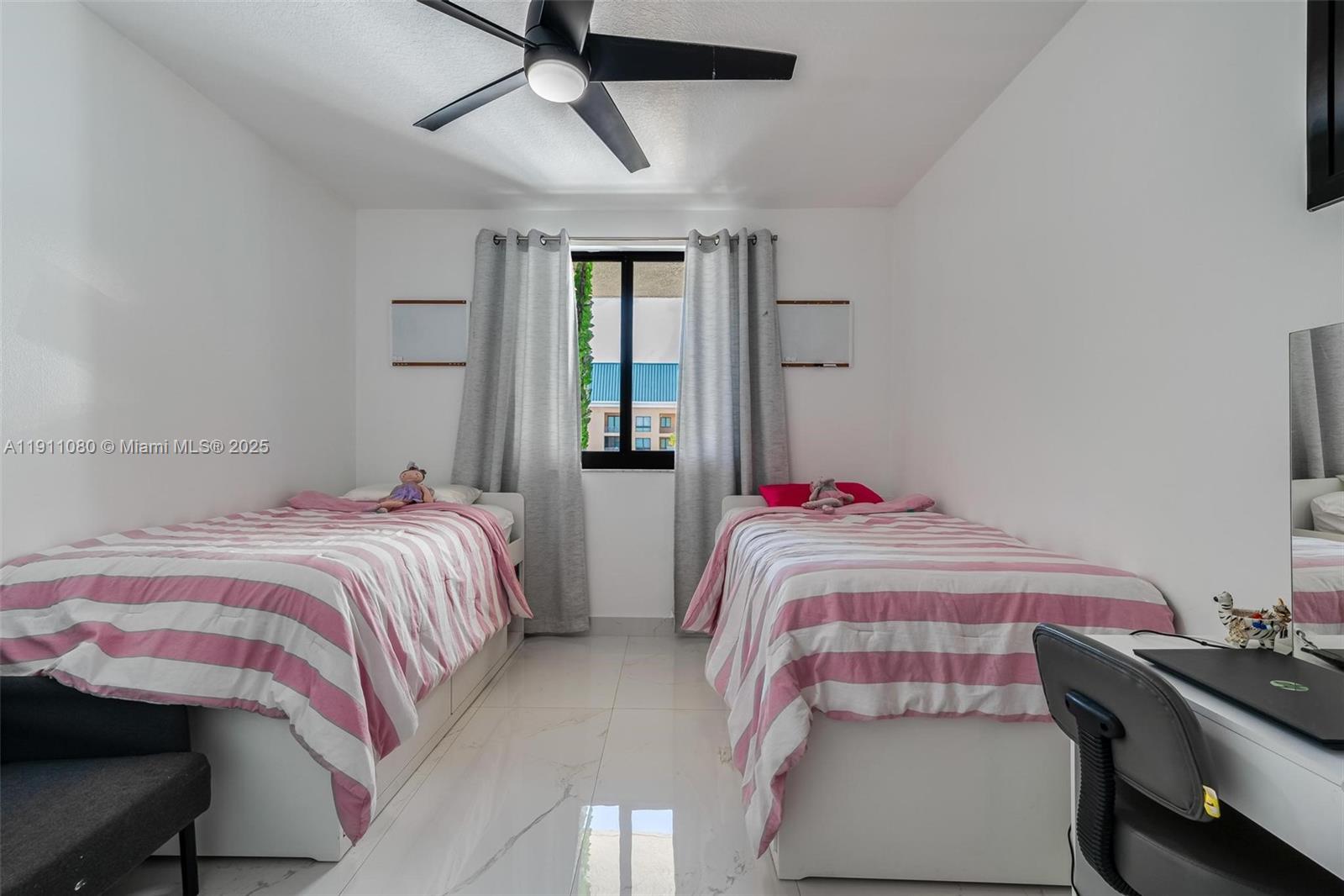 100 North Federal Highway, Unit 1413 Fort Lauderdale, FL 33301 - Photo 15 of 33 a bedroom with a bed and a chandelier