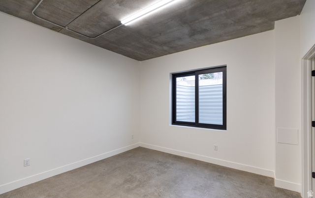 3667 Little Cottonwood Road, Unit 1 Sandy, UT 84092 - Photo 37 of 49 Concrete flooring with a contrasting white wall finish