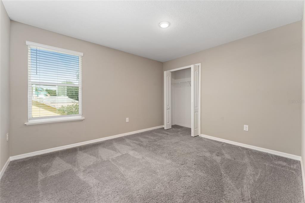 4331 Wayne Road Fruitland Park, FL 34731 - Photo 29 of 46 an empty room with windows