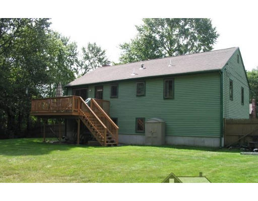 56 Little Farms Road Framingham, MA 01701 - Photo 2 of 4 a front view of a house with a garden