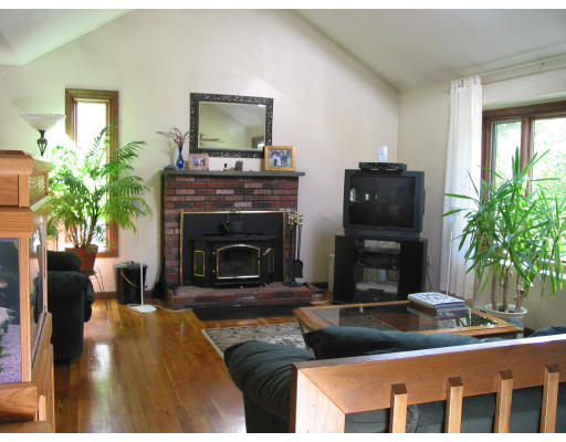 56 Little Farms Road Framingham, MA 01701 - Photo 3 of 4 a living room with furniture and a fireplace
