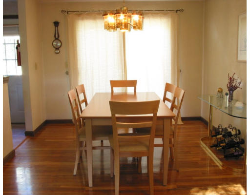56 Little Farms Road Framingham, MA 01701 - Photo 4 of 4 a view of a dining room with furniture and wooden floor