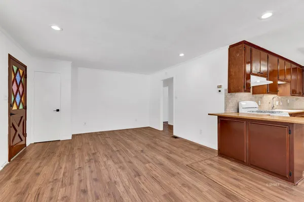 a view of kitchen with wooden floor