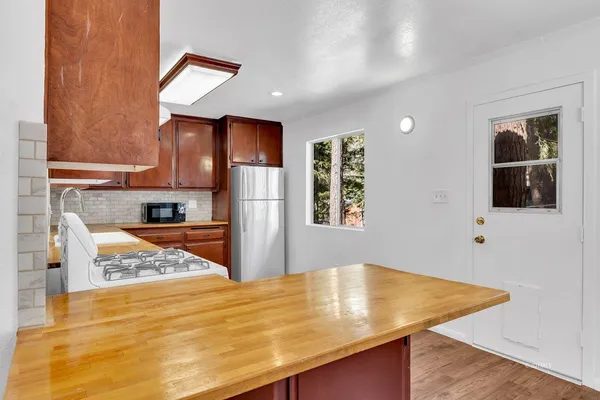 a view of kitchen with wooden floor