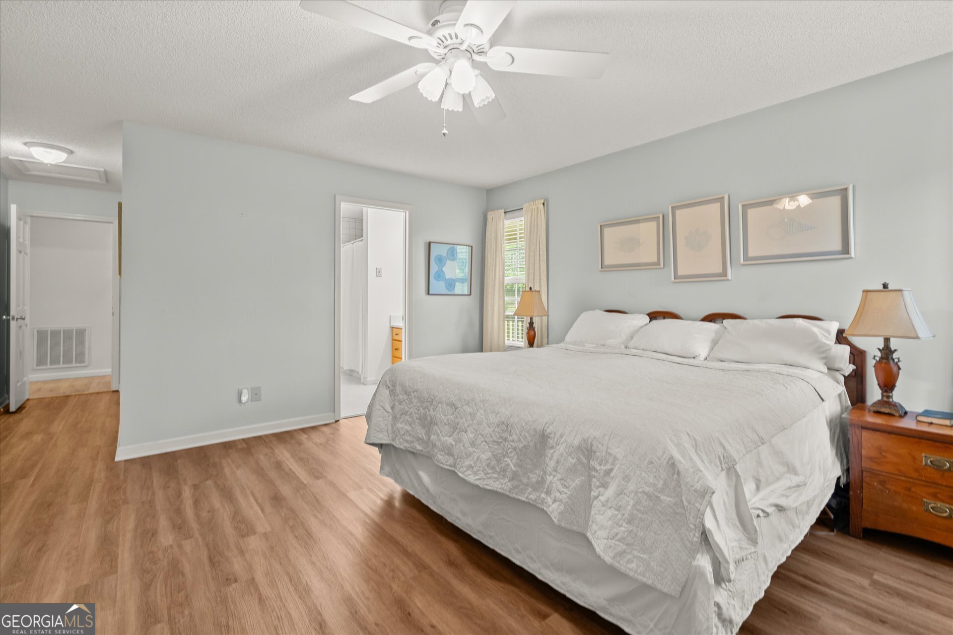2643 Macedonia Road Franklin, GA 30217 - Photo 11 of 47 a spacious bedroom with a bed and a chandelier