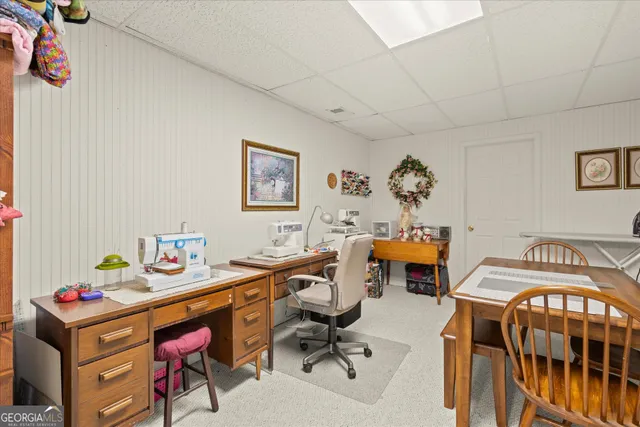 a view of a workspace with furniture