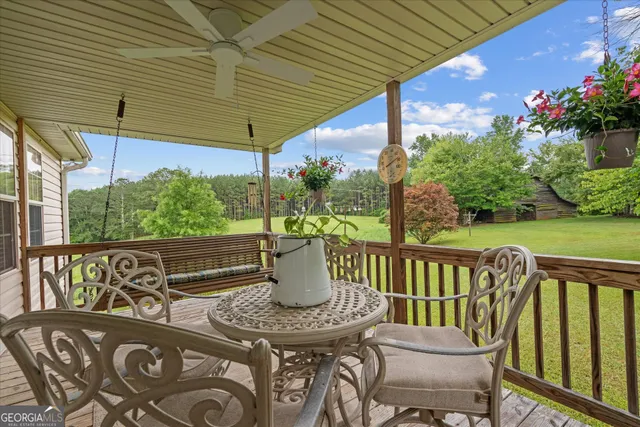 a view of a two chairs and table in the patio