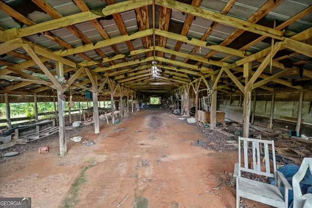 a view of a porch with a table and chairs