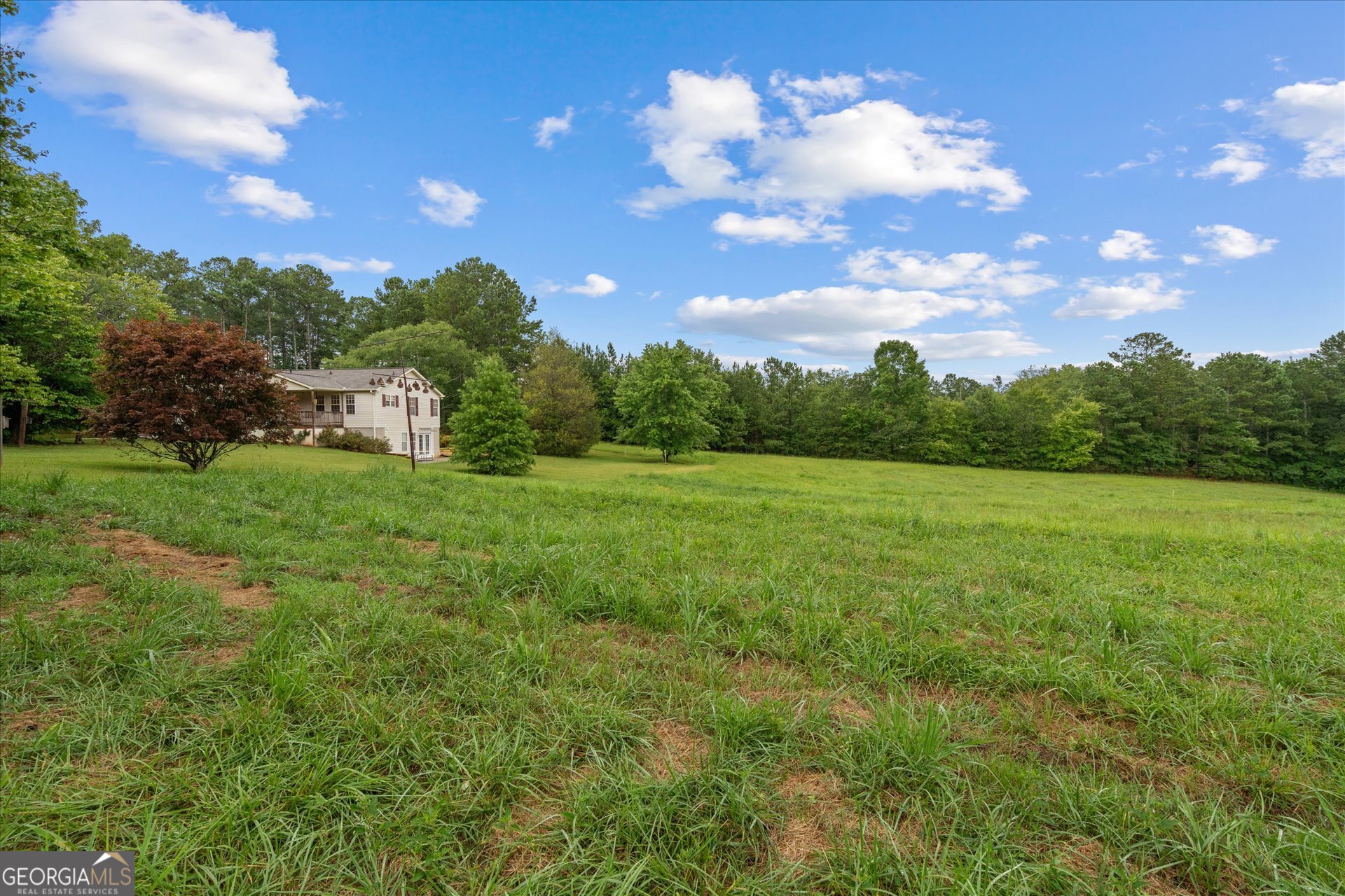2643 Macedonia Road Franklin, GA 30217 - Photo 36 of 47 a view of a big yard with swimming pool and green space