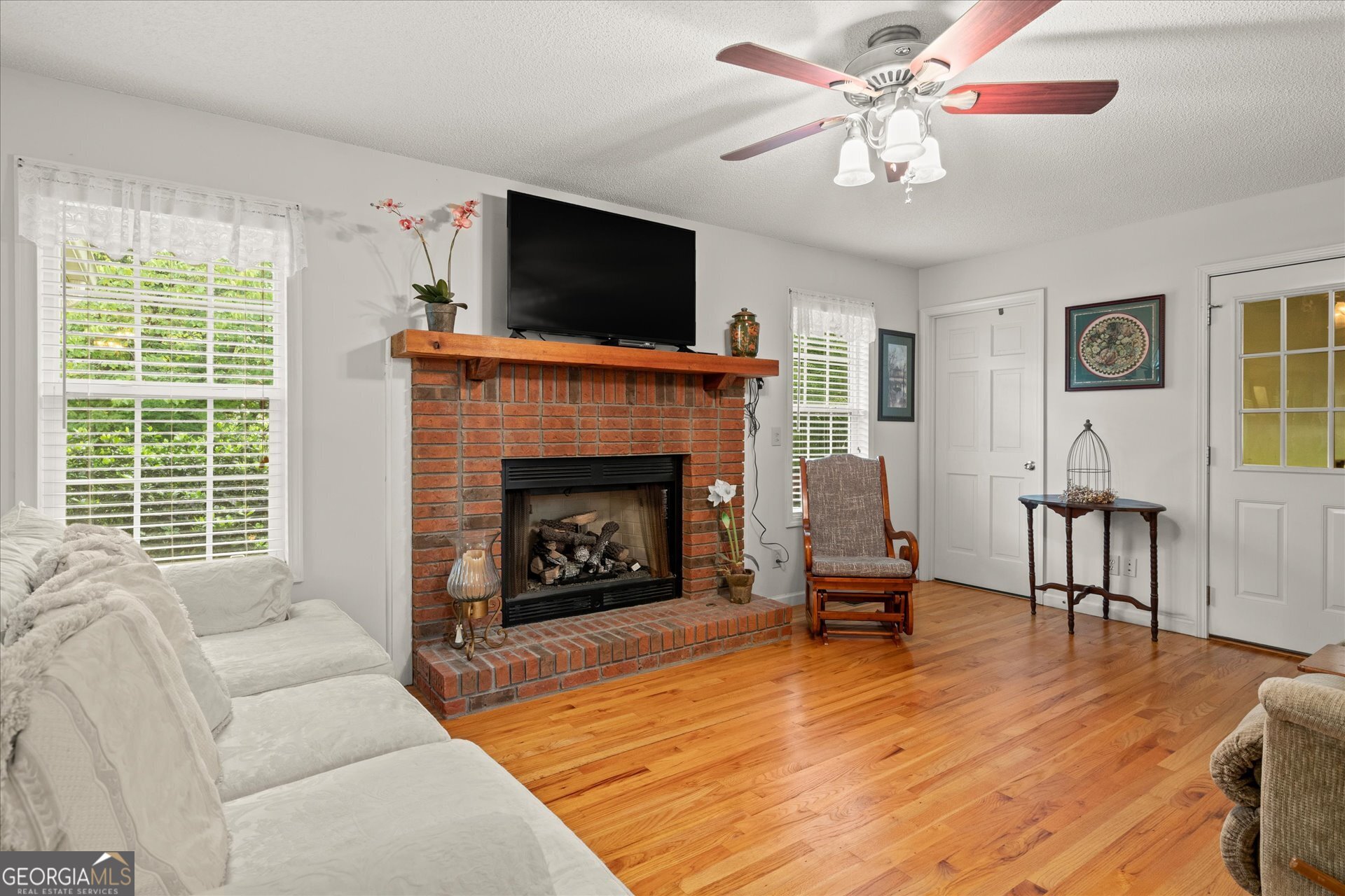 2643 Macedonia Road Franklin, GA 30217 - Photo 5 of 47 a living room with furniture flat screen tv and a fireplace