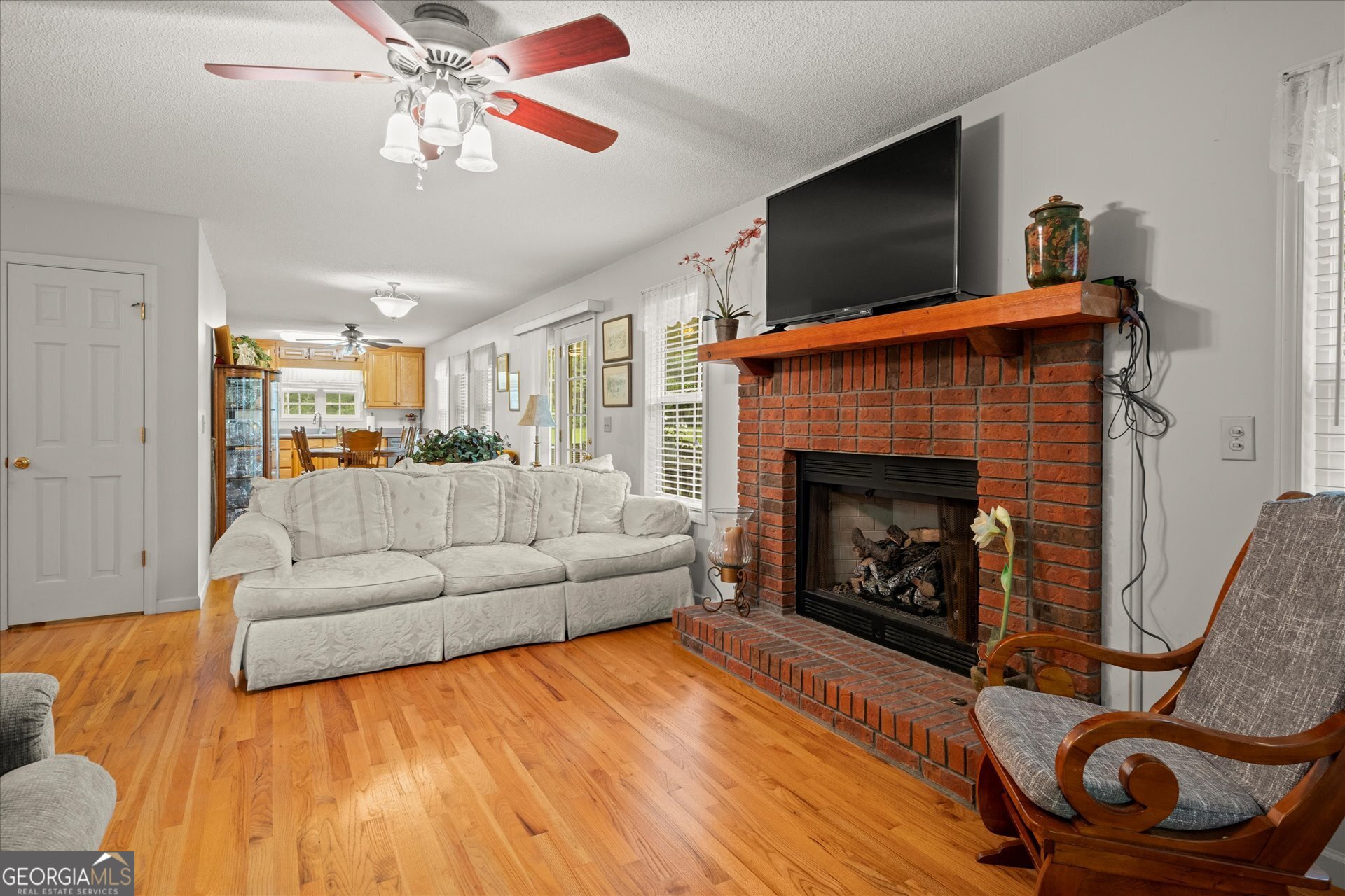 2643 Macedonia Road Franklin, GA 30217 - Photo 7 of 47 a living room with furniture and a fireplace