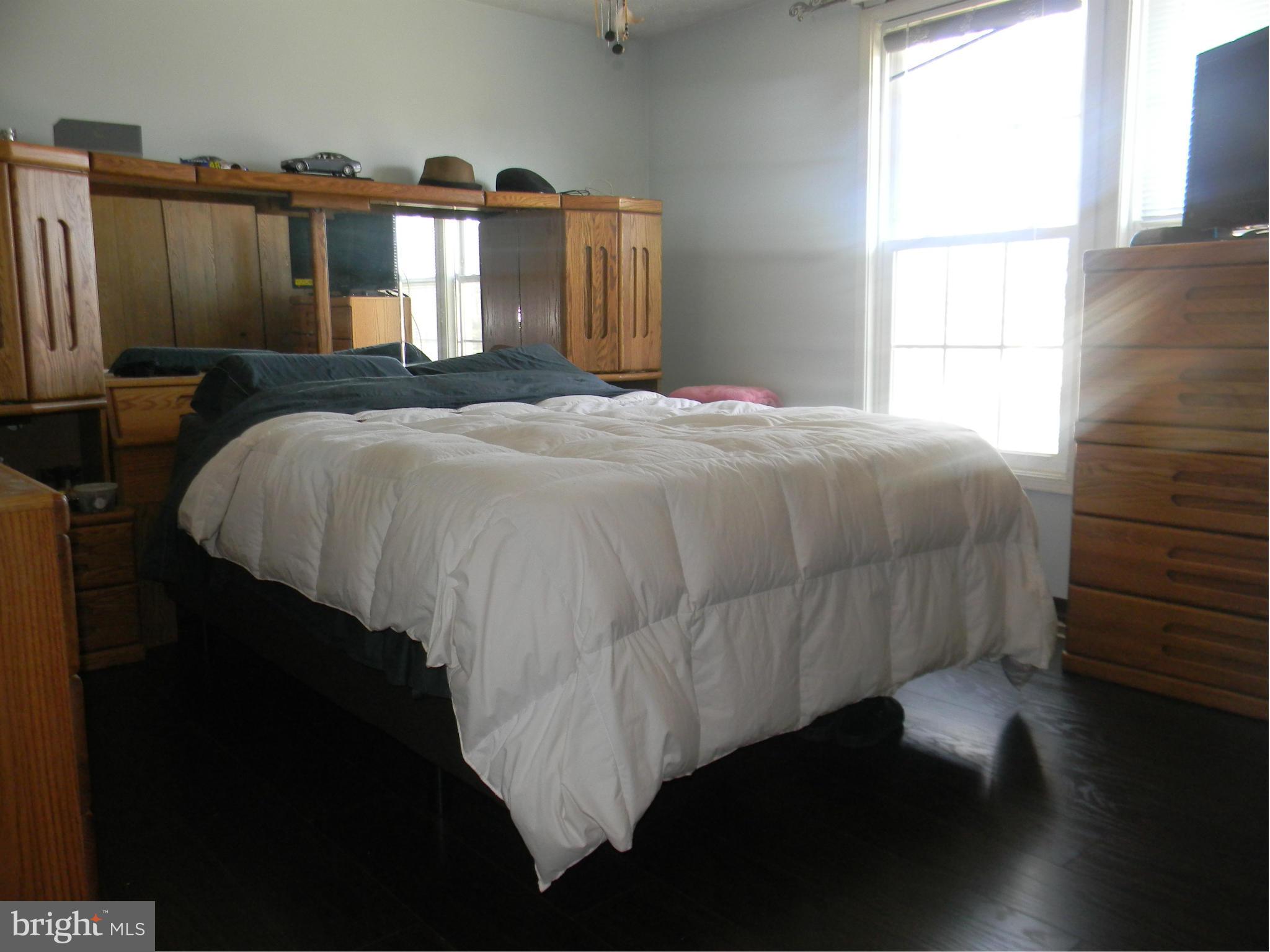 3102 Northmont Road Baltimore, MD 21244 - Photo 14 of 25 a bedroom with a bed and a window