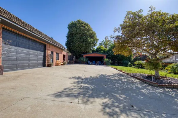 a view of a room with stairs and a wooden floor