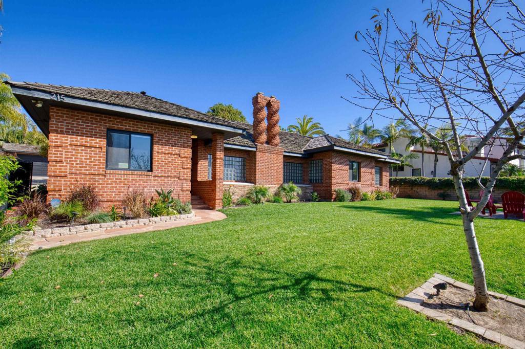 215 North Vulcan Avenue Encinitas, CA 92024 - Photo 16 of 37 a front view of a house with a yard
