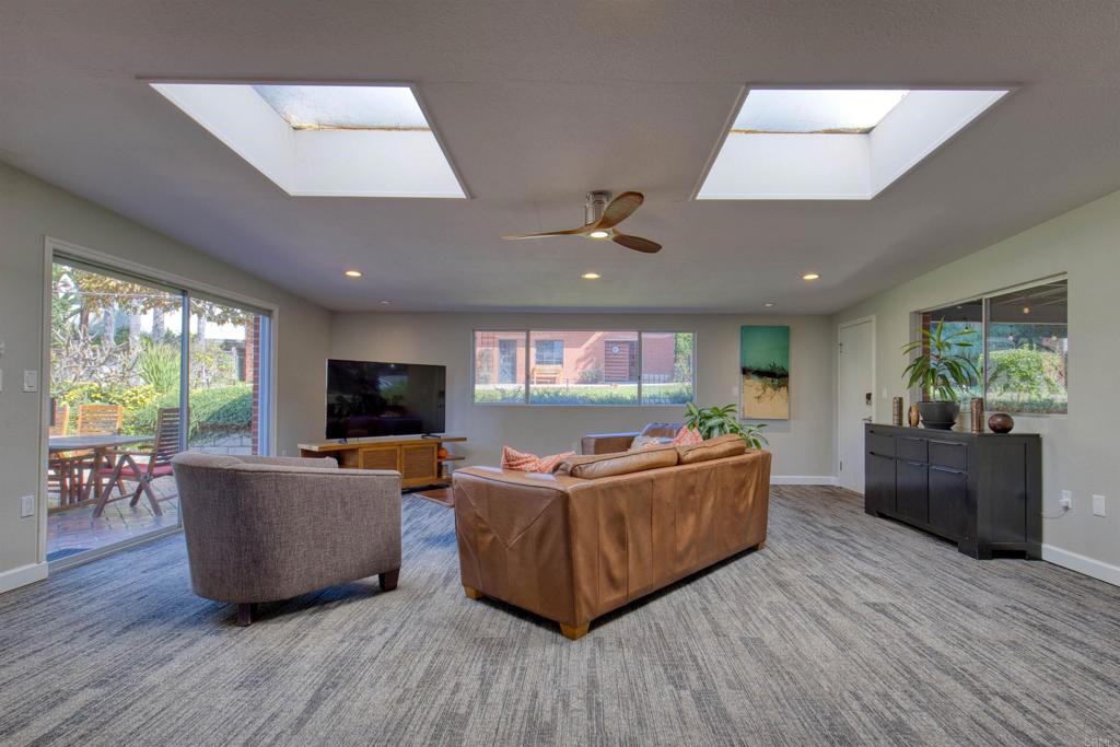 215 North Vulcan Avenue Encinitas, CA 92024 - Photo 19 of 37 a living room with furniture and a flat screen tv