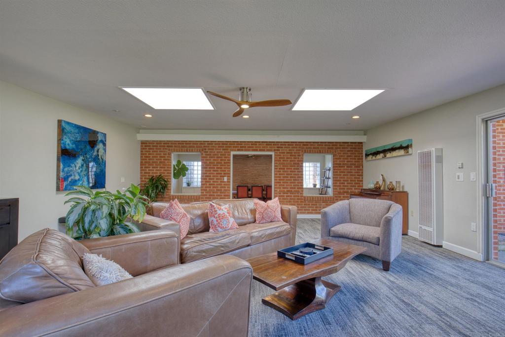 215 North Vulcan Avenue Encinitas, CA 92024 - Photo 21 of 37 a living room with furniture and wooden floor