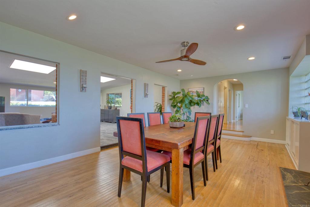 215 North Vulcan Avenue Encinitas, CA 92024 - Photo 23 of 37 a view of a dining room with furniture and wooden floor