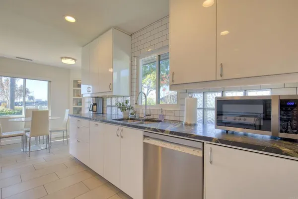 a view of a dining room with furniture and window