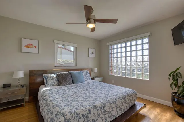 a bedroom with a bed and window