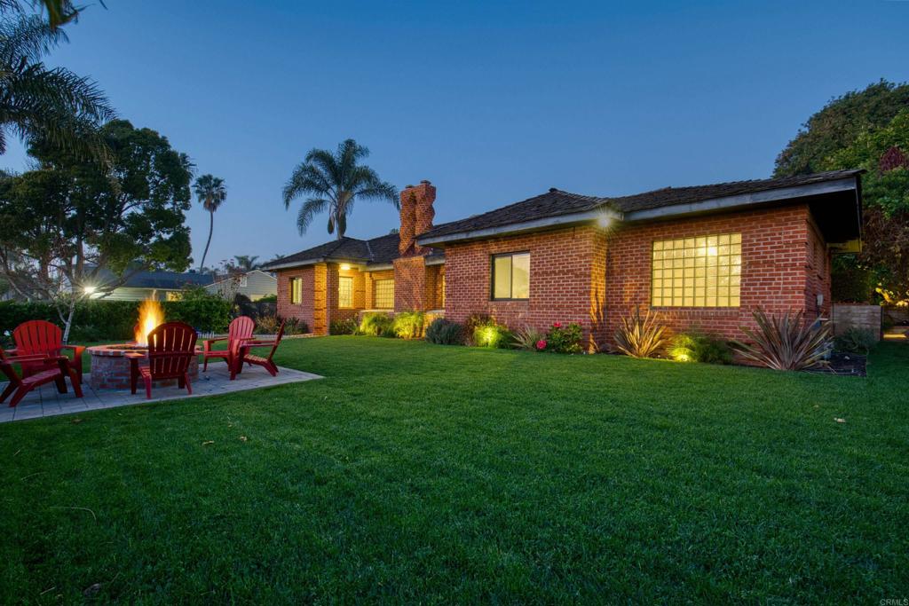 215 North Vulcan Avenue Encinitas, CA 92024 - Photo 37 of 37 a front view of a house with a garden and patio