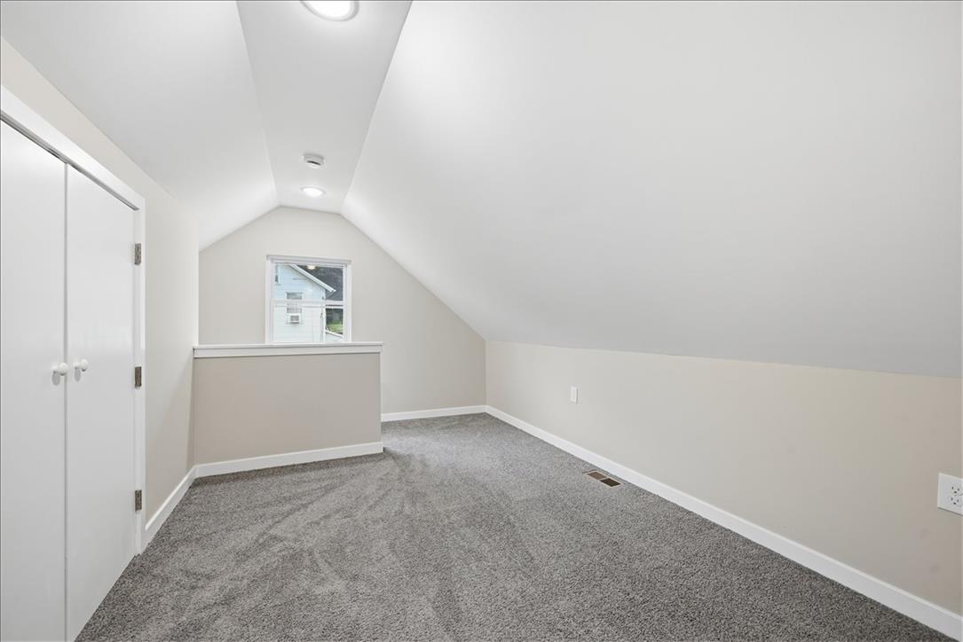 5641 North Coplay Road Whitehall, PA 18052 - Photo 44 of 68 A versatile loft space featuring sloped ceilings and plush carpeting.