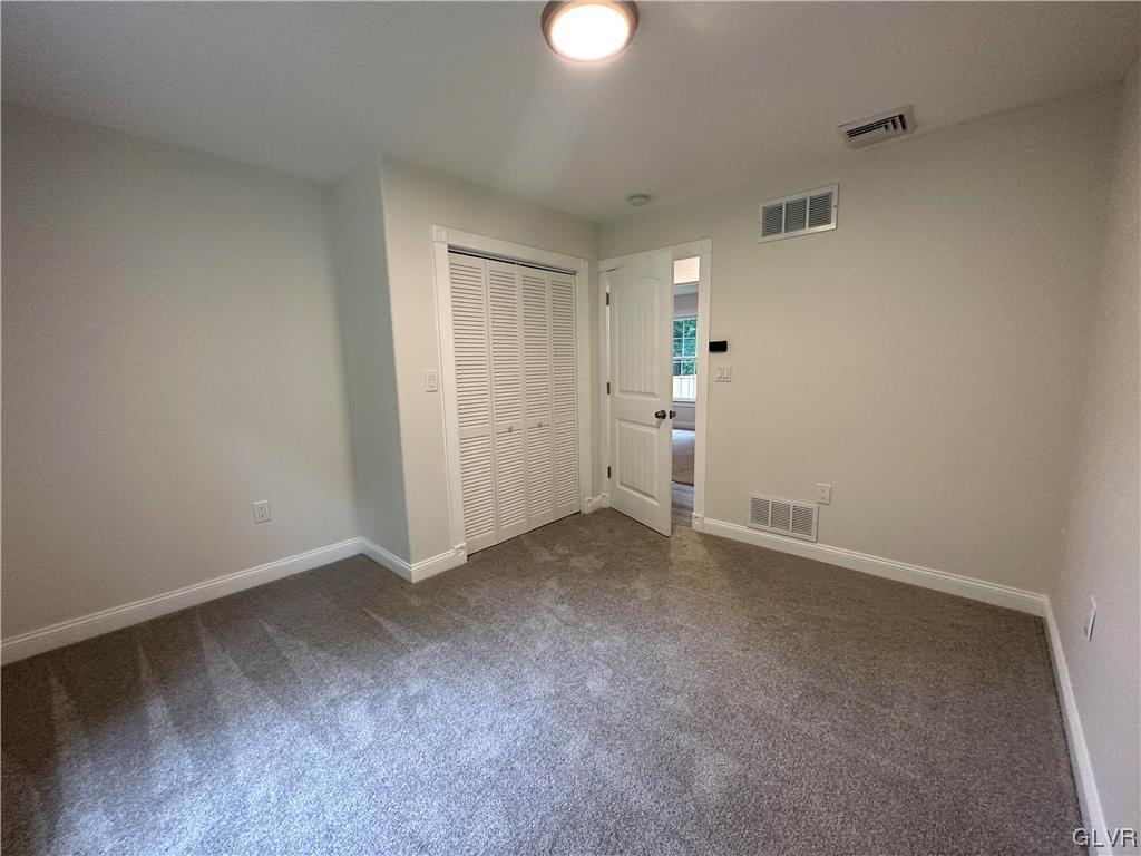 1204 Lakeside Drive Effort, PA 18330 - Photo 18 of 25 an empty room with an entryway and a fan