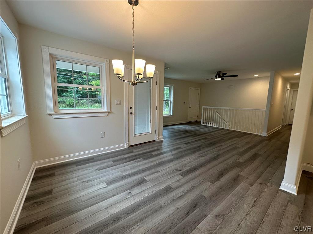 1204 Lakeside Drive Effort, PA 18330 - Photo 3 of 25 a view of a room with wooden floor staircase and a kitchen