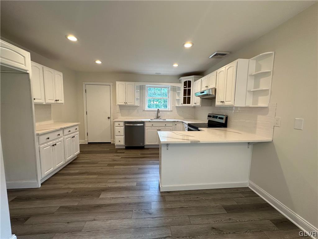 1204 Lakeside Drive Effort, PA 18330 - Photo 4 of 25 a kitchen with stainless steel appliances a refrigerator sink and cabinets