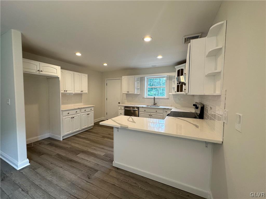 1204 Lakeside Drive Effort, PA 18330 - Photo 6 of 25 a large white kitchen with a white countertops a stove and a refrigerator