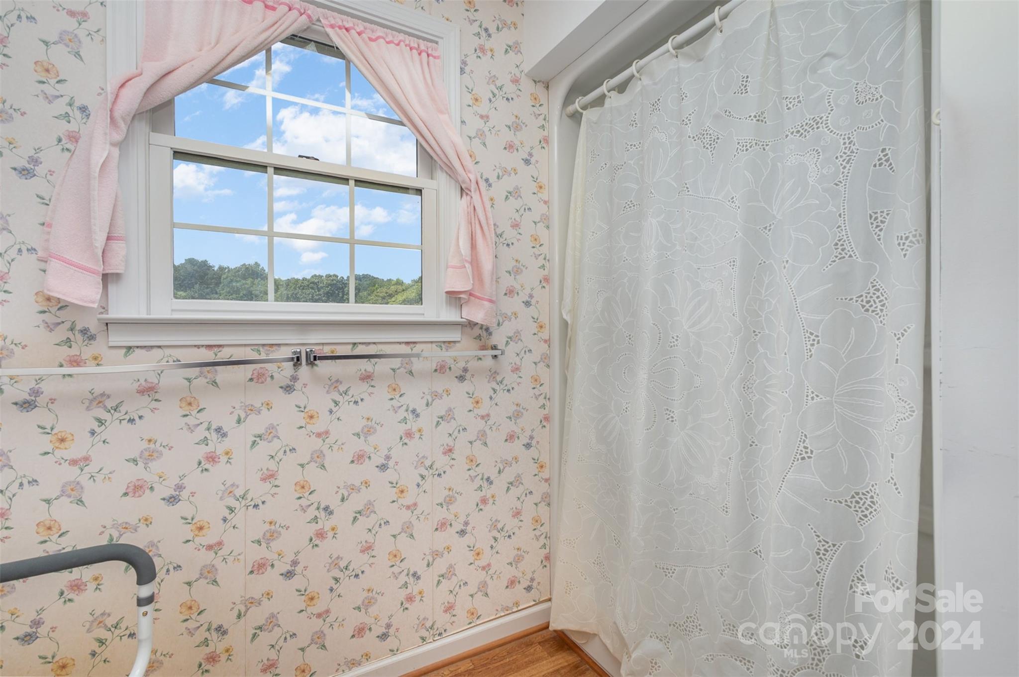 5306 Macedonia Church Road Vale, NC 28168 - Photo 19 of 35 a bathroom with a window and a shower curtain