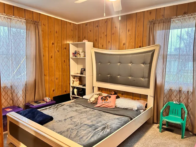 a room with a bed and a window