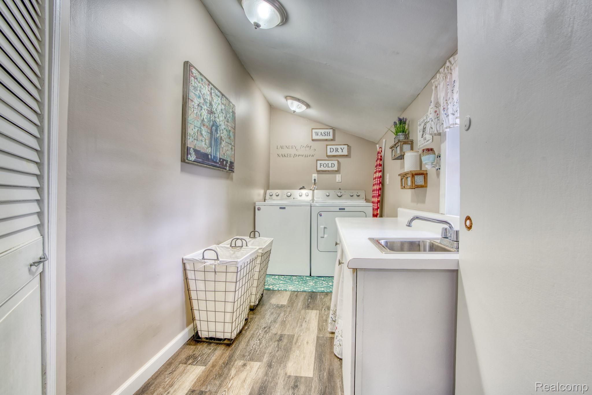 4065 Jewell Road Howell, MI 48843 - Photo 27 of 62 LAUNDRY ROOM ALSO HAS NEW FLOORING