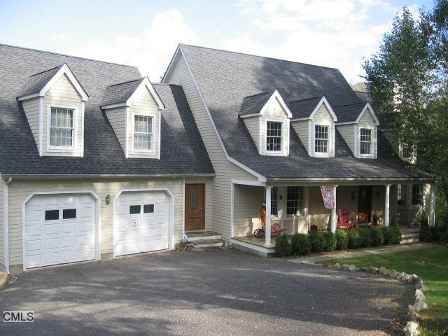 134 Umpawaug Road Redding, CT 06896 - Photo 1 of 1 a front view of a house with a yard