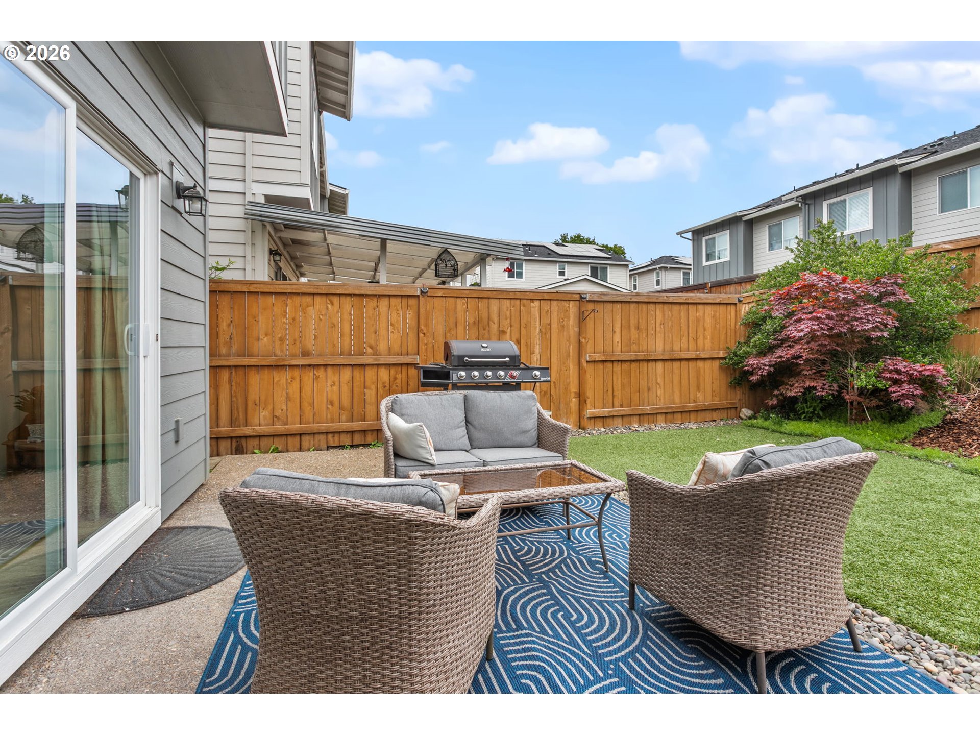 808 South 23rd Avenue Cornelius, OR 97113 - Photo 27 of 36 a view of a patio with couches table and chairs and potted plants