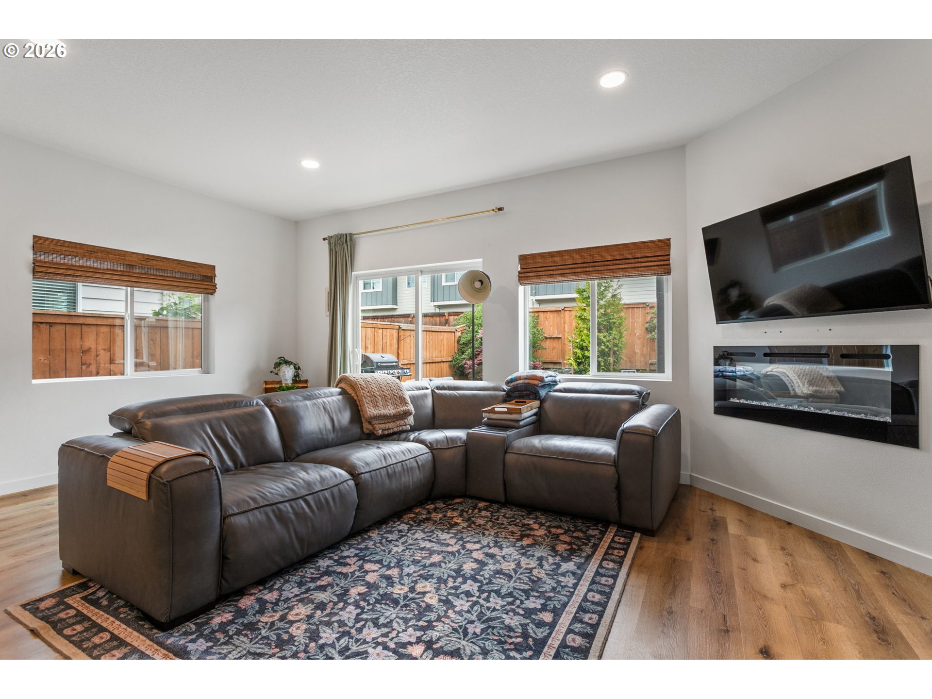 808 South 23rd Avenue Cornelius, OR 97113 - Photo 7 of 36 a living room with furniture a flat screen tv and a window