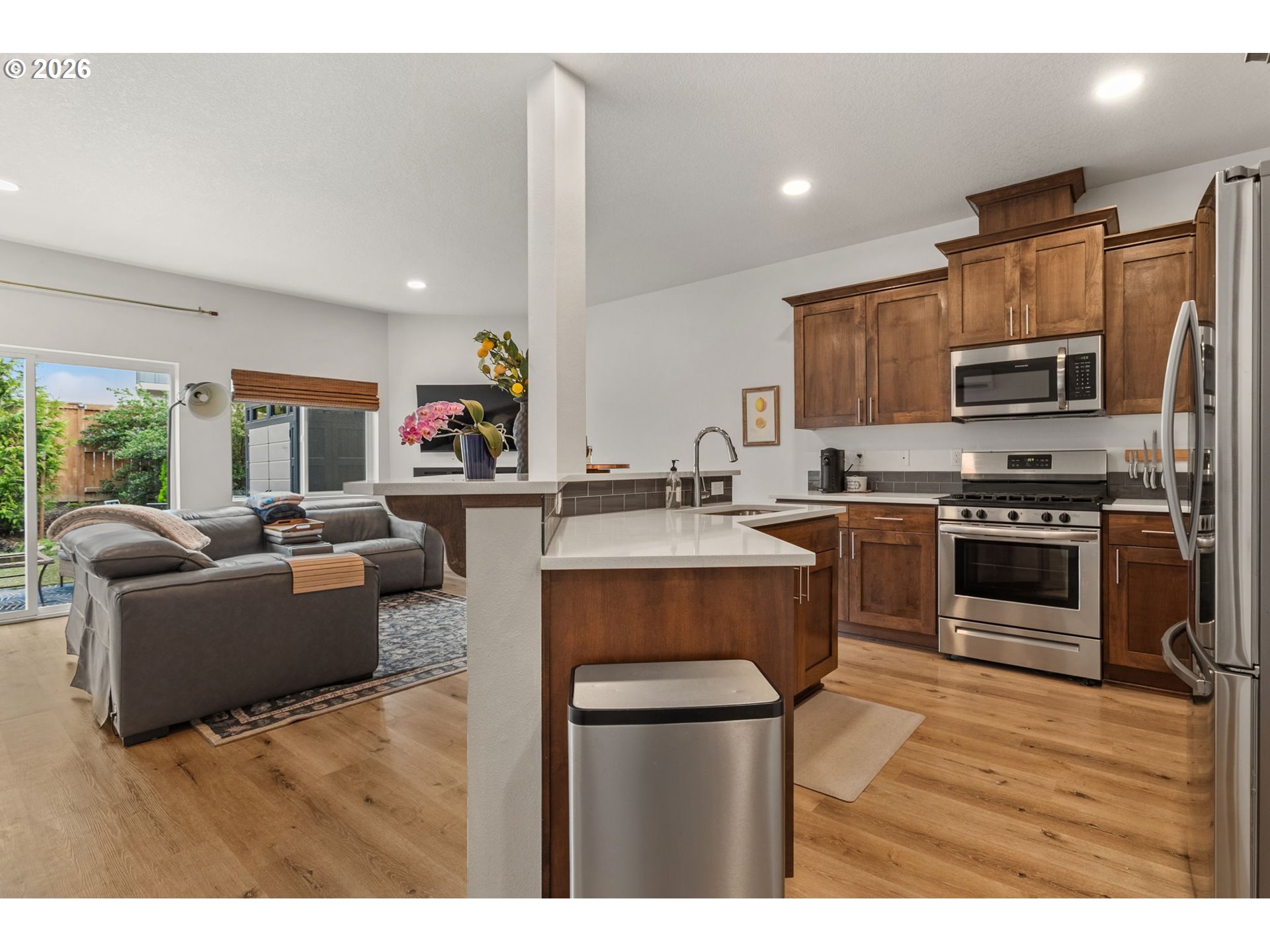 808 South 23rd Avenue Cornelius, OR 97113 - Photo 10 of 36 a kitchen with kitchen island a sink cabinets and stainless steel appliances