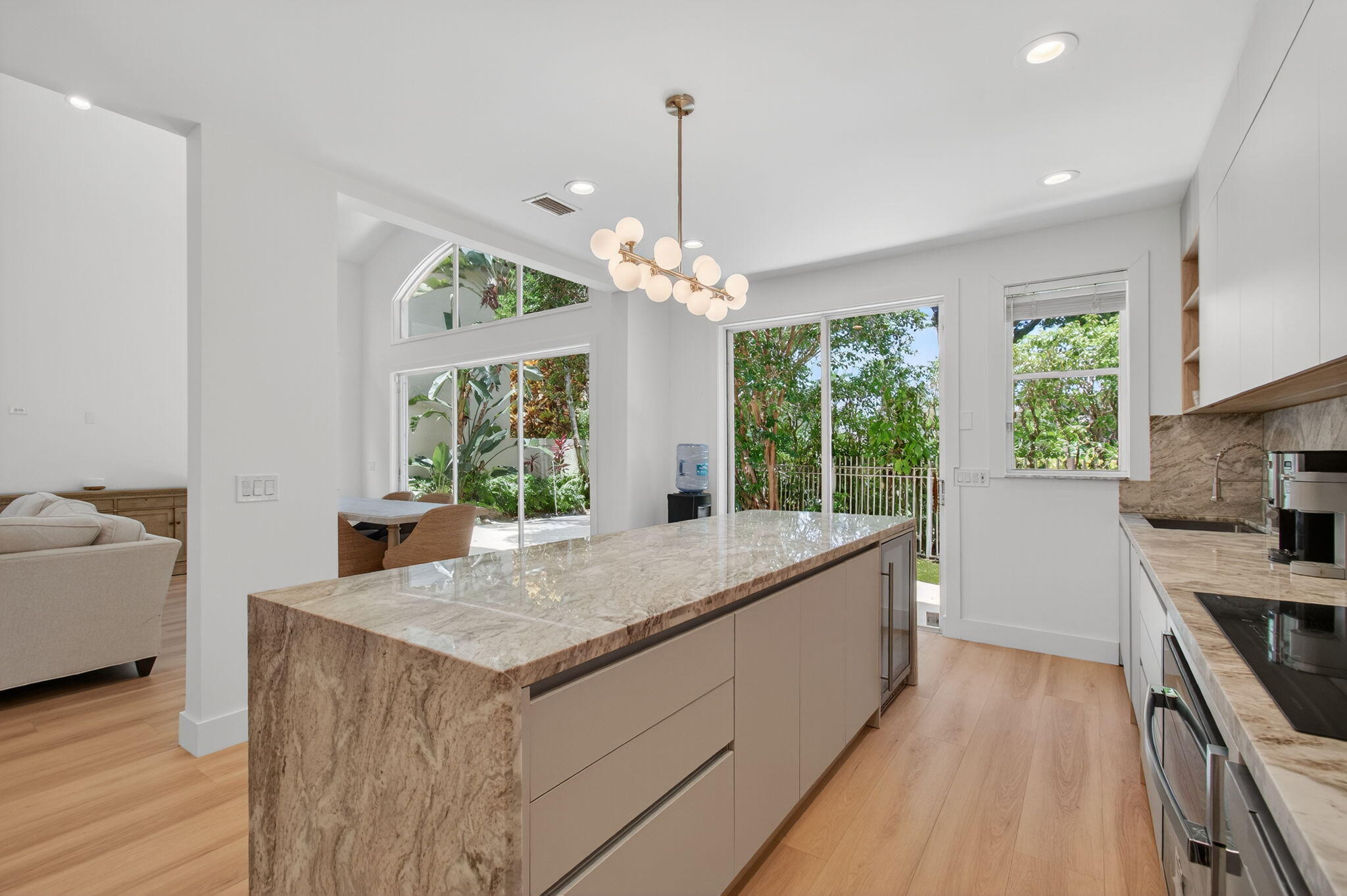 2621 Northwest 53rd Drive Boca Raton, FL 33496 - Photo 14 of 52 a kitchen with counter top space and windows