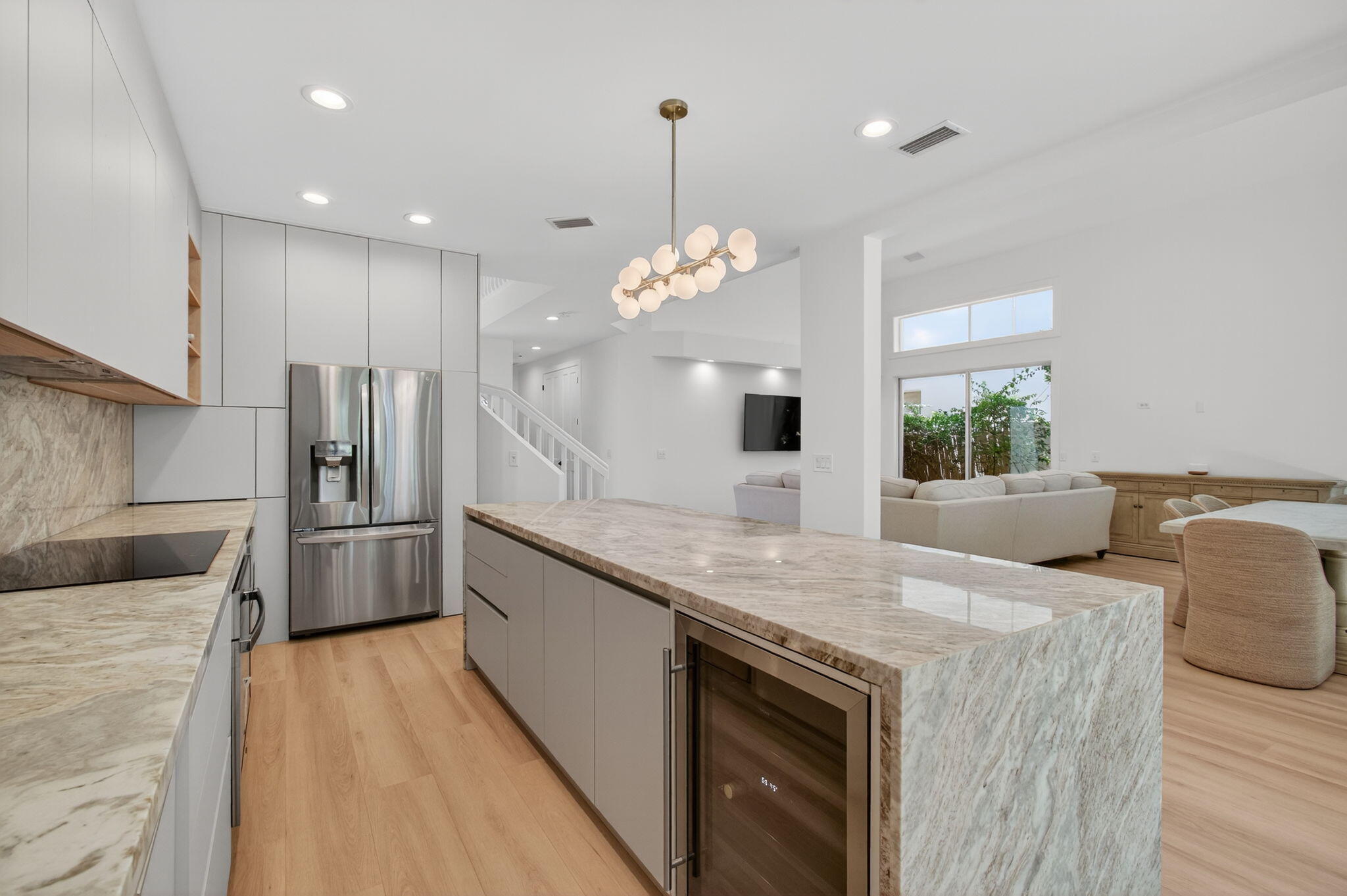 2621 Northwest 53rd Drive Boca Raton, FL 33496 - Photo 15 of 52 a kitchen with stainless steel appliances granite countertop a sink refrigerator and window