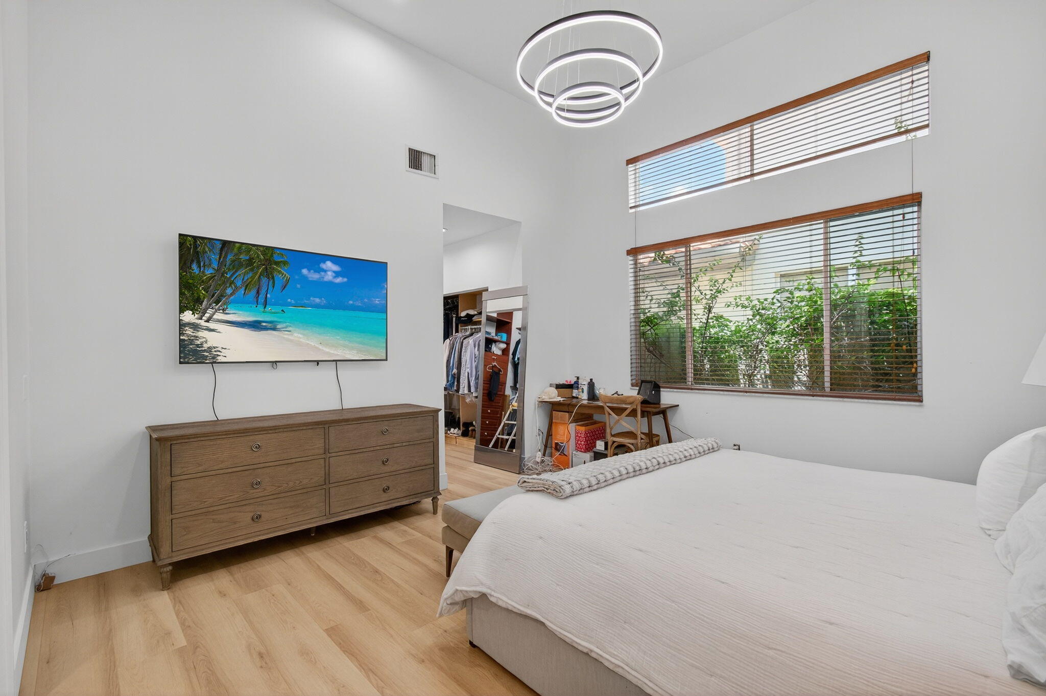 2621 Northwest 53rd Drive Boca Raton, FL 33496 - Photo 19 of 52 a bedroom with bed and a flat tv screen