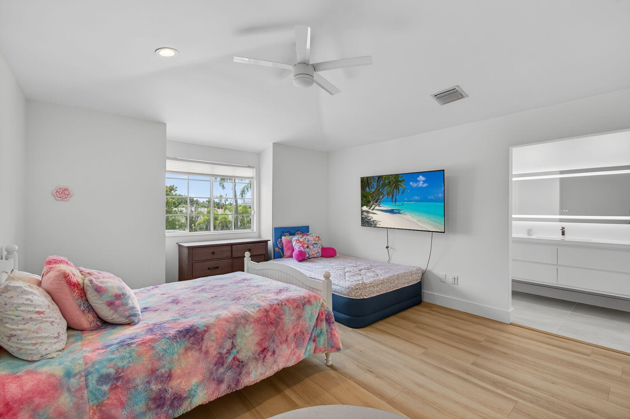 2621 Northwest 53rd Drive Boca Raton, FL 33496 - Photo 27 of 52 a bedroom with two beds and a window